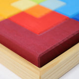 Close up of the Grimm's large creative puzzle square wooden toy in a wooden storage display tray. 