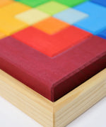 Close up of the Grimm's large creative puzzle square wooden toy in a wooden storage display tray. 