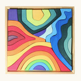 Grimms large elements set showing individual wooden coloured pieces in a frame