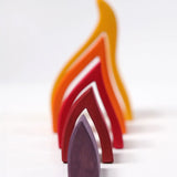 Grimms handcrafted wooden fire set showing each flame piece lined up from small to large