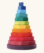 Grimms large geometric tower stacking toy. Includes 12 handcrafted wooden geometric shapes and a base in a rainbow palette