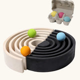 Grimm's large monochrome 12 piece rainbow set up as a ball run with Pastel Grimm's wooden balls.