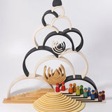 Grimm's large monochrome 12 piece rainbow stacked u along with other Grimm's rainbows, building boards, semi circles and friends peg dolls. 