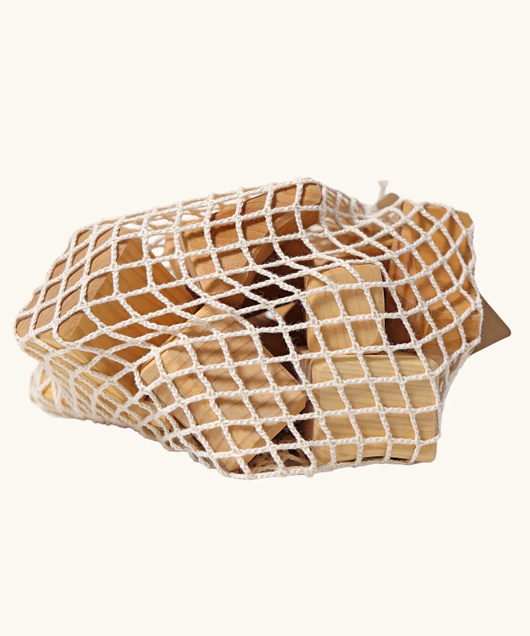 Grimm's large wooden natural building blocks set in it's string storage bag.