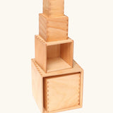 A stack of Grimms large natural wooden building boxes