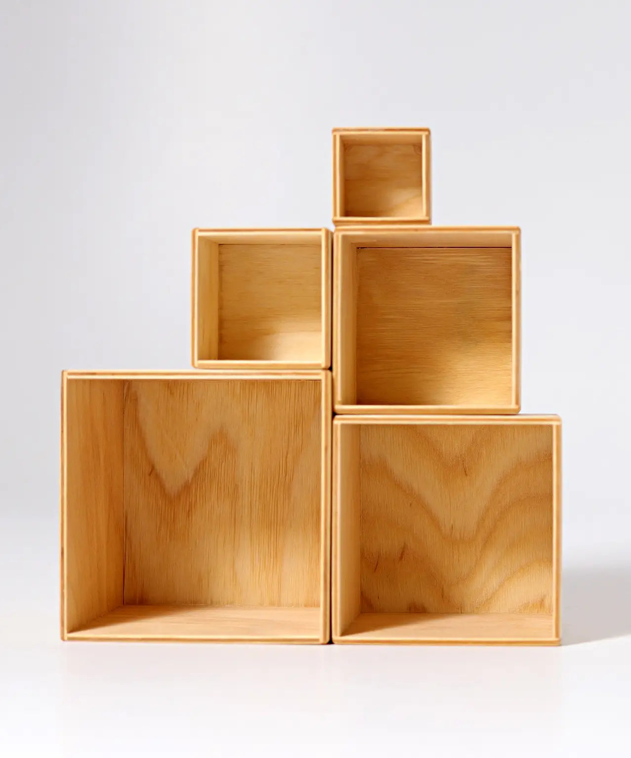 Grimms large natural wooden building boxes stacked on top of eachother