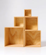 Grimms large natural wooden building boxes stacked on top of eachother