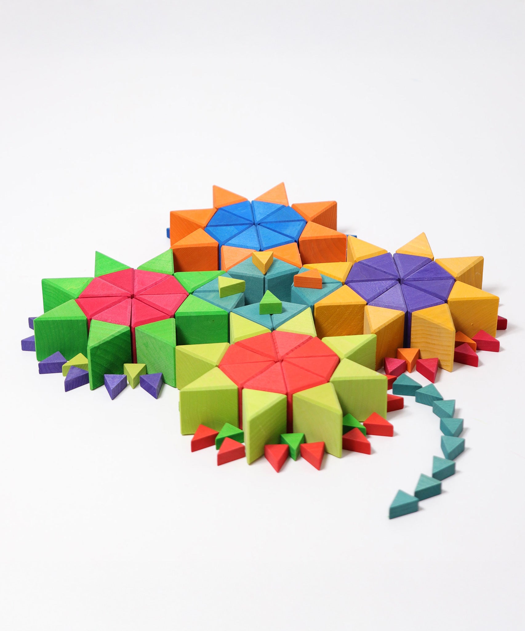 The triangluar shaped blocks from the Grimm's Octagon Puzzles used to created flower shapes withe the large set used for the flowers and the smaller sets used for the stems and details. 