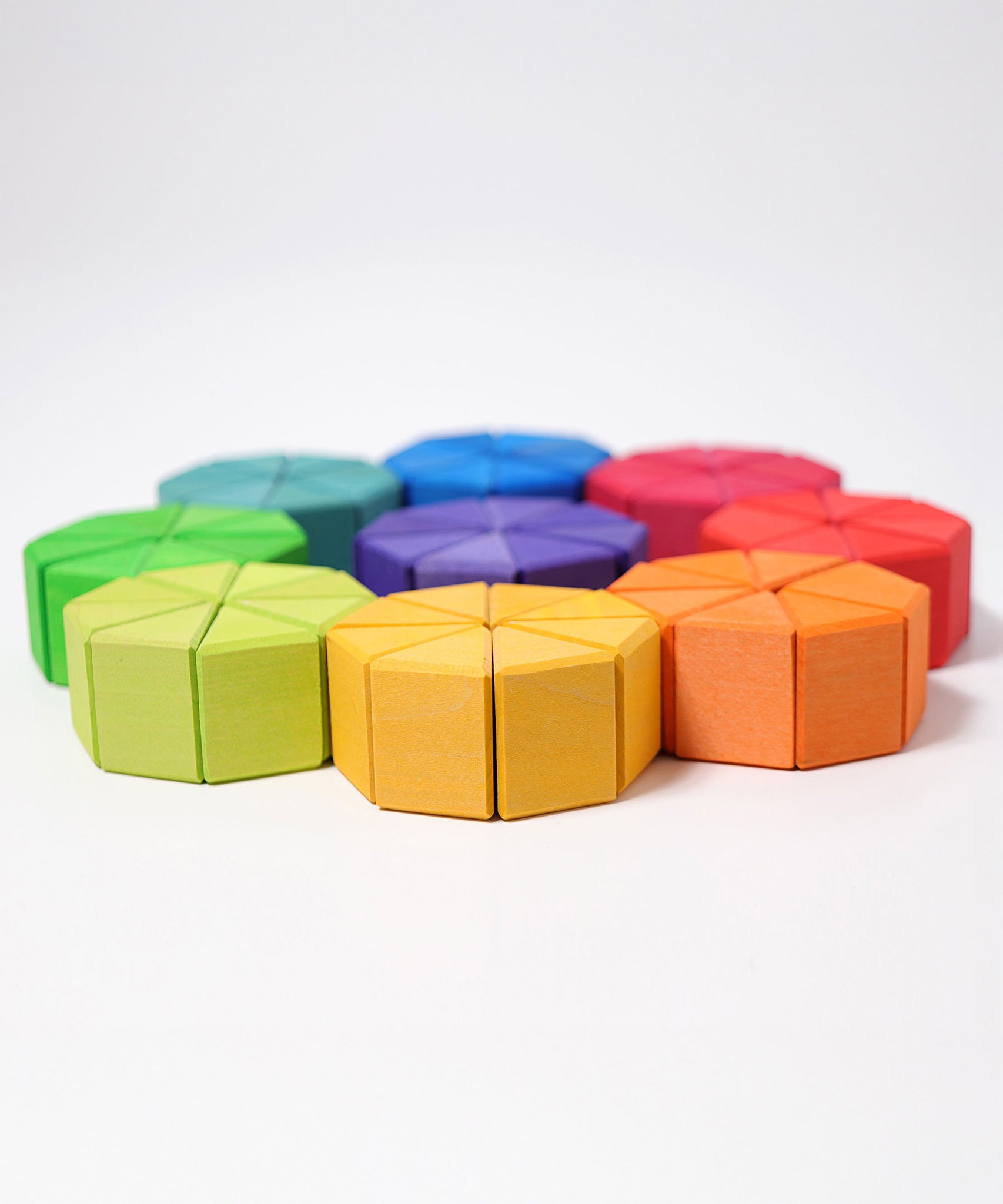 The triangular shaped blocks from the Grimm's Large Octagon Puzzle laid out to form circles. 
