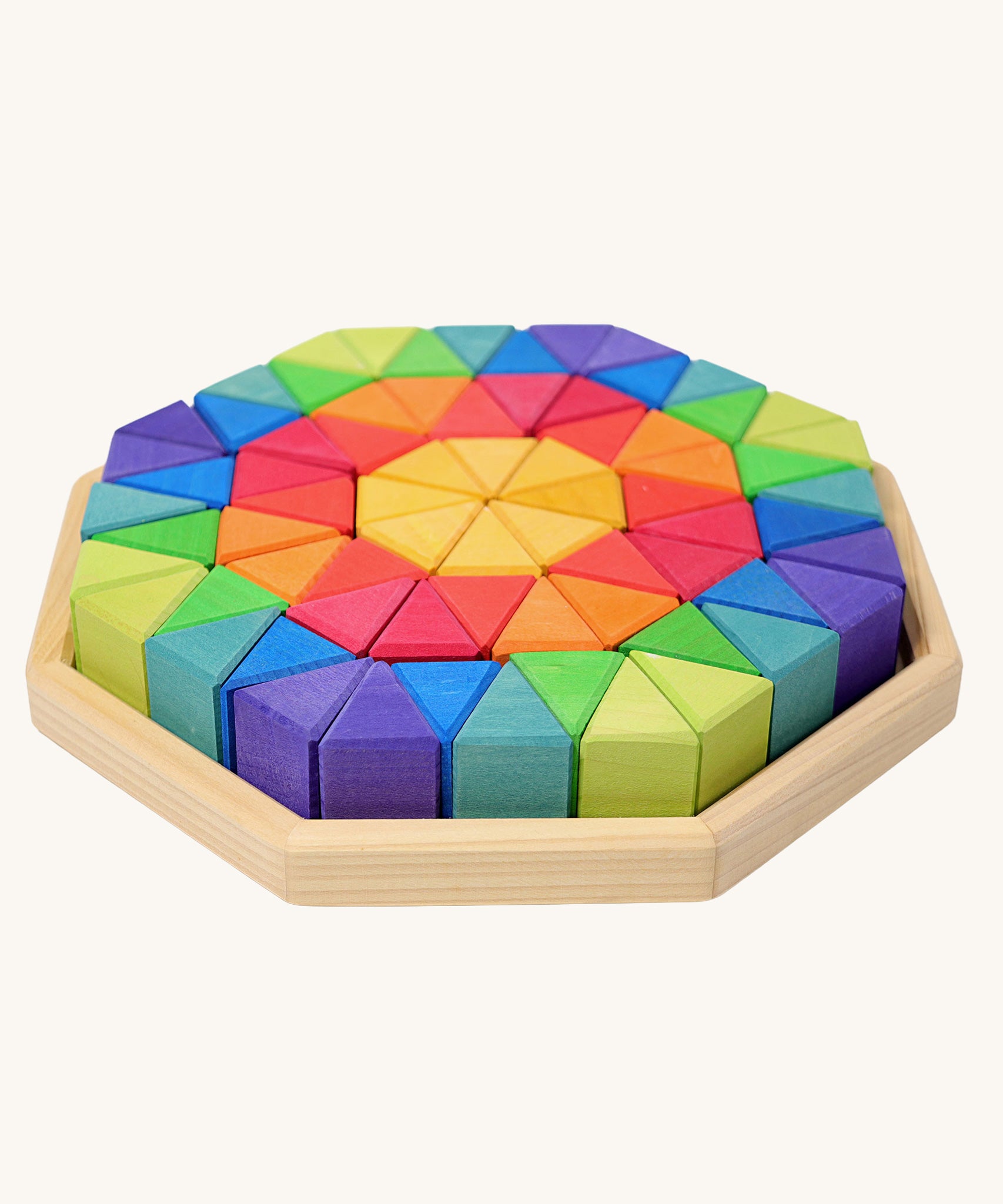 Grimm's Large Octagon Wooden Puzzle set containing rainbow coloured triangular shaped blocks in a wooden storage tray. 