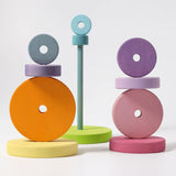 A balancing game using the disk pieces from the Grimms large conical tower in pastel colours