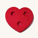 Grimm's Large Red Heart Celebration Ring on a plain background. 