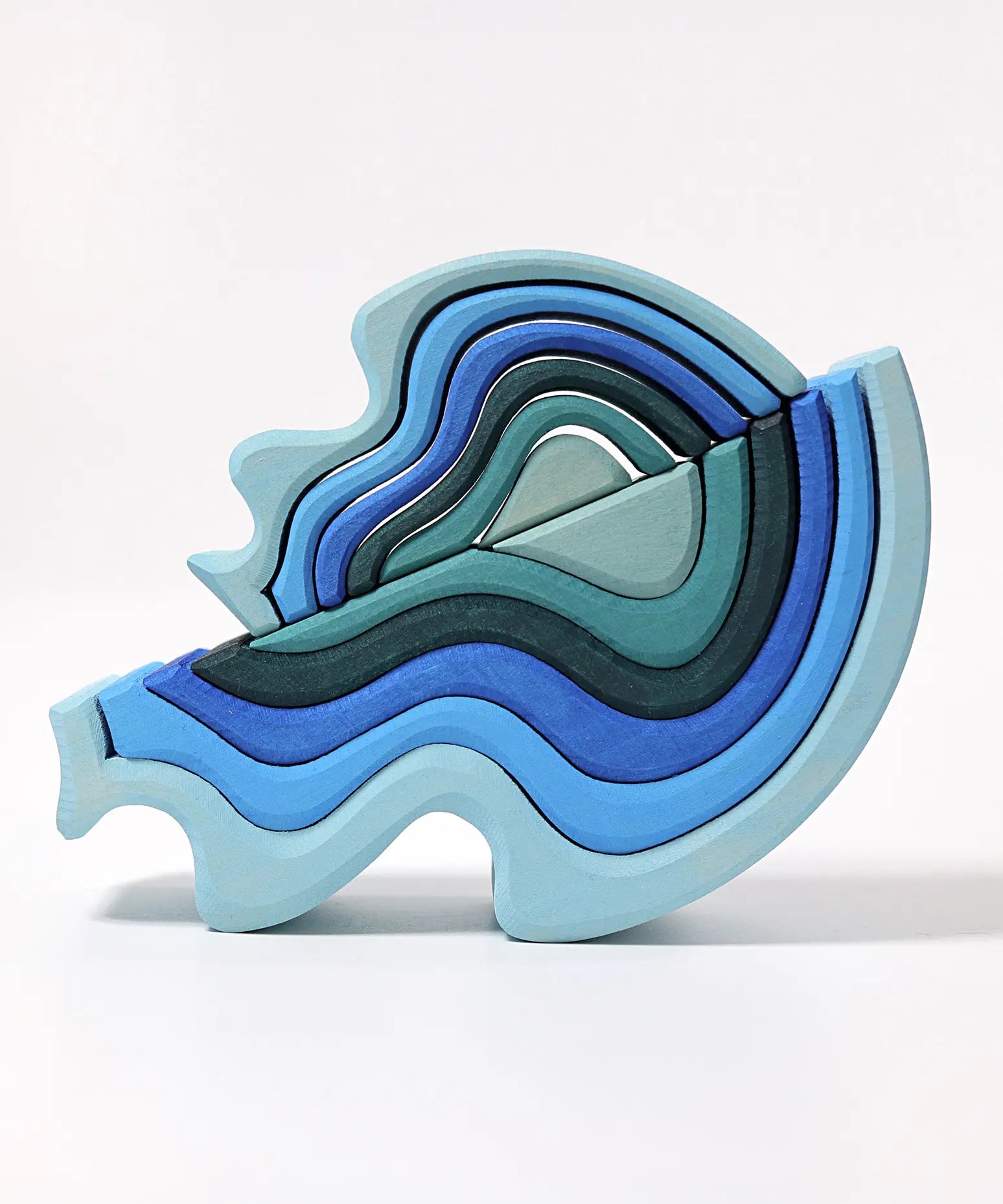 Grimms wooden blue water waves standing on top of a matching larger set