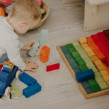 Grimms large stepped wooden counting blocks in Grimm’s World of Numbers palette made for counting and learning. 