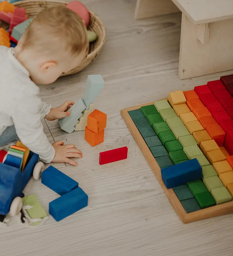 Grimms large stepped wooden counting blocks in Grimm’s World of Numbers palette made for counting and learning. 