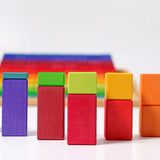 Grimms large stepped wooden counting blocks in Grimm’s World of Numbers palette made for counting and learning. Stacked into a visual math fraction