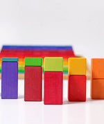 Grimms large stepped wooden counting blocks in Grimm’s World of Numbers palette made for counting and learning. Stacked into a visual math fraction