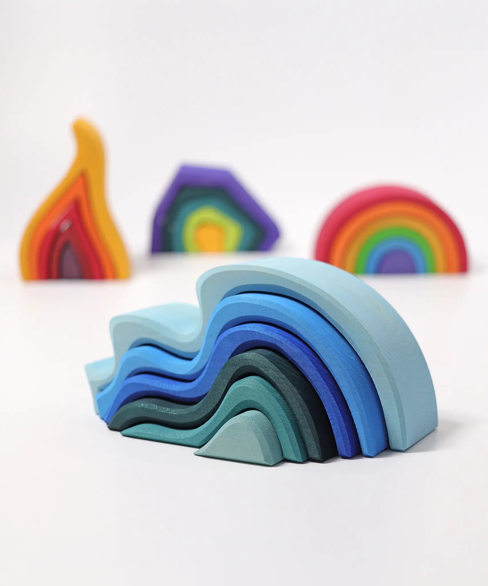 Grimms handcrafted wooden water waves set in front of other element sets