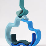 A abstract stack using the Grimm's handcrafted blue wave pieces.
