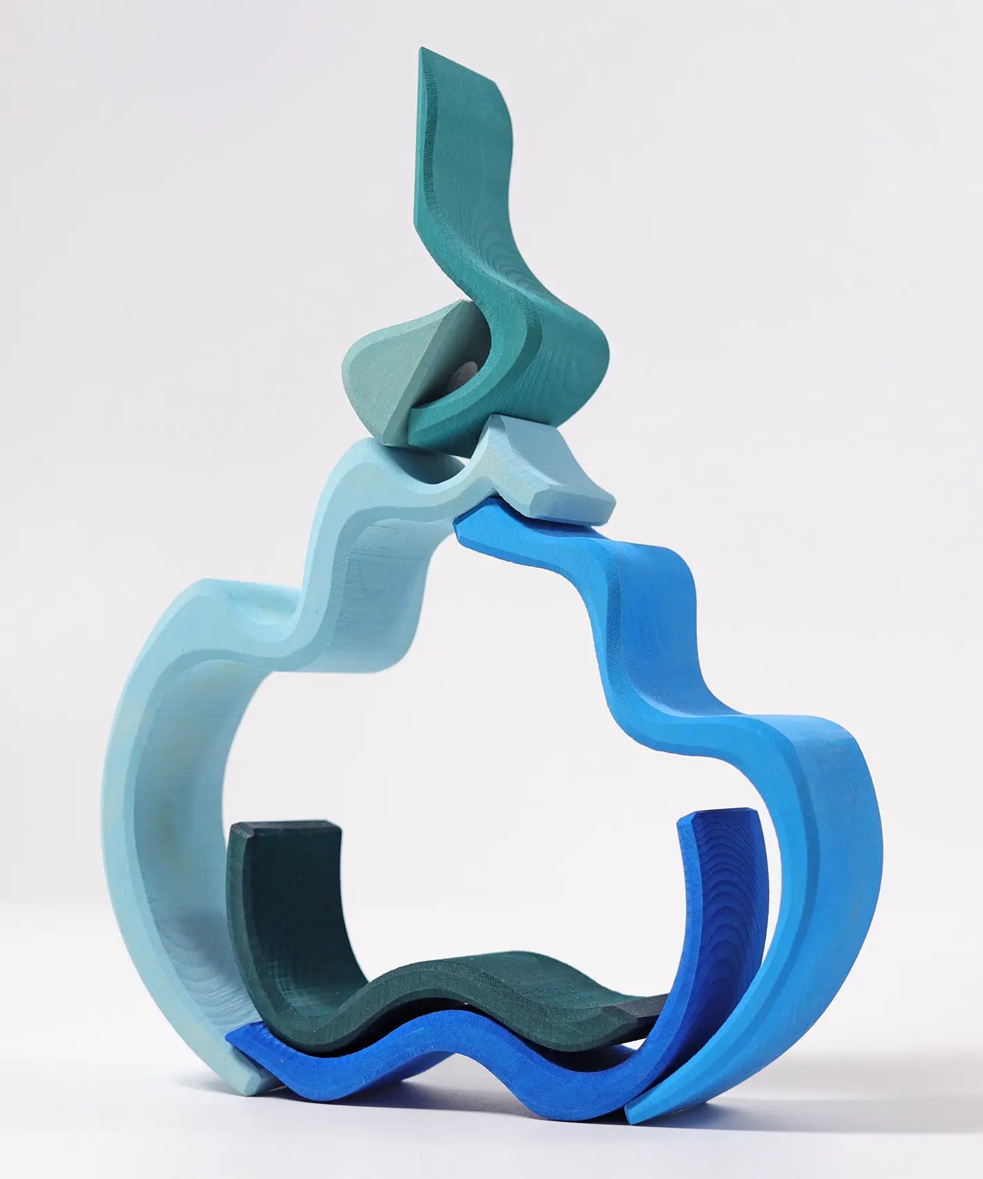 A abstract stack using the Grimm's handcrafted blue wave pieces.
