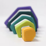 Grimm's earth showing 5 handcrafted wooden angular arched pieces line up from small to large