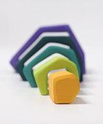 Grimm's earth showing 5 handcrafted wooden angular arched pieces line up from small to large
