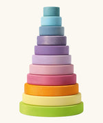 Grimms large wooden conical tower in pastel colours. A 11 piece set with chunky disk pieces, a base with a peg for stacking and counting games