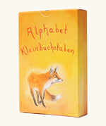 Grimms letter supplementary card set for learning the alphabet, phonics and spelling out simple words. Showing a warm orange yellow packaging with a fox illustration 