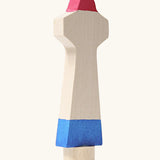 Side of Grimm's handcrafted wooden lighthouse figure showing thickness of the figure