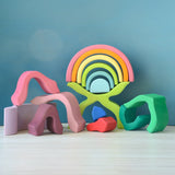 Loose pieces from the Grimms wooden little flower set stacked on top of each other