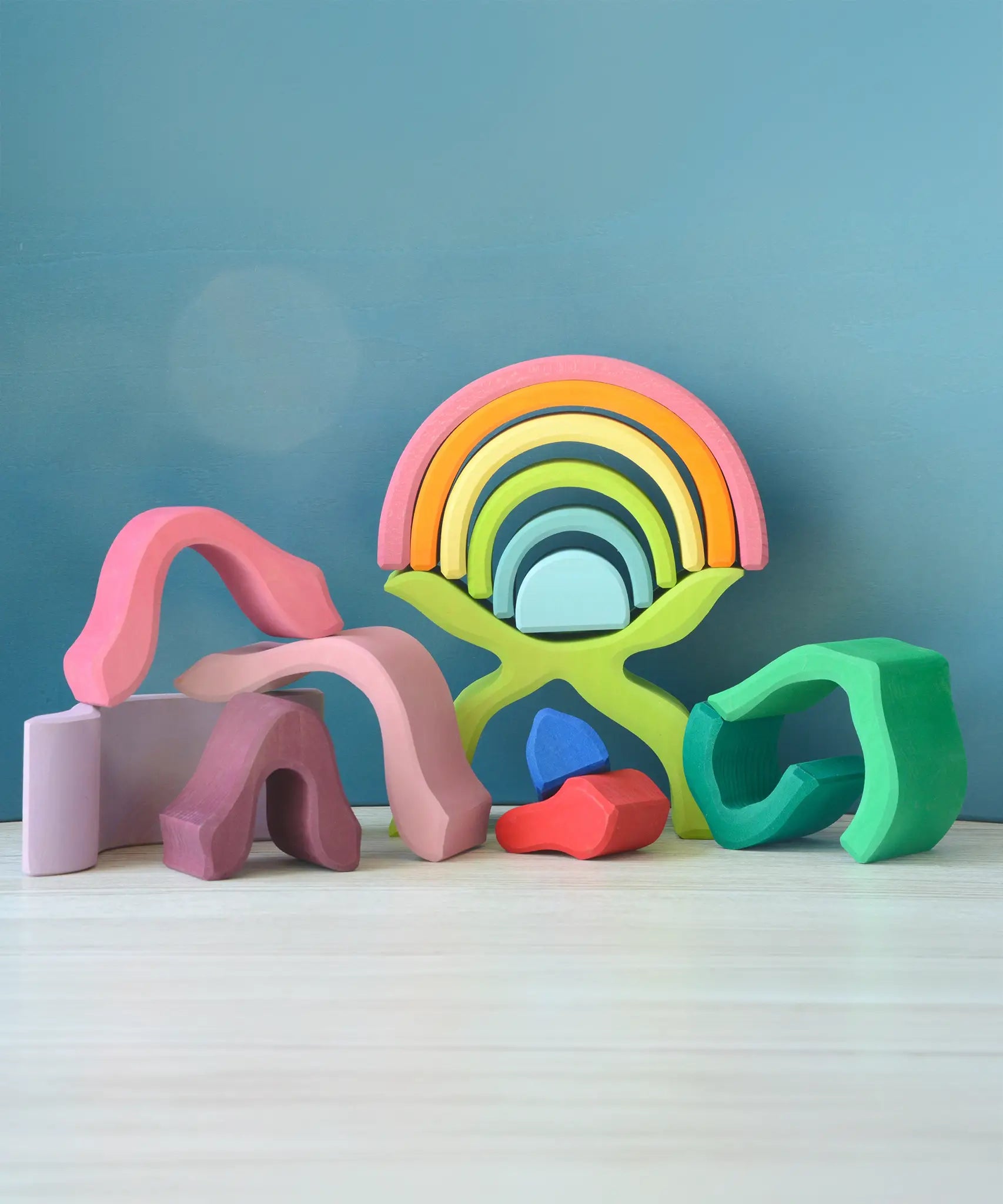 Loose pieces from the Grimms wooden little flower set stacked on top of each other