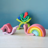 Pieces from the Grimms wooden little flower and medium pastel rainbow made into snails