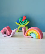 Pieces from the Grimms wooden little flower and medium pastel rainbow made into snails