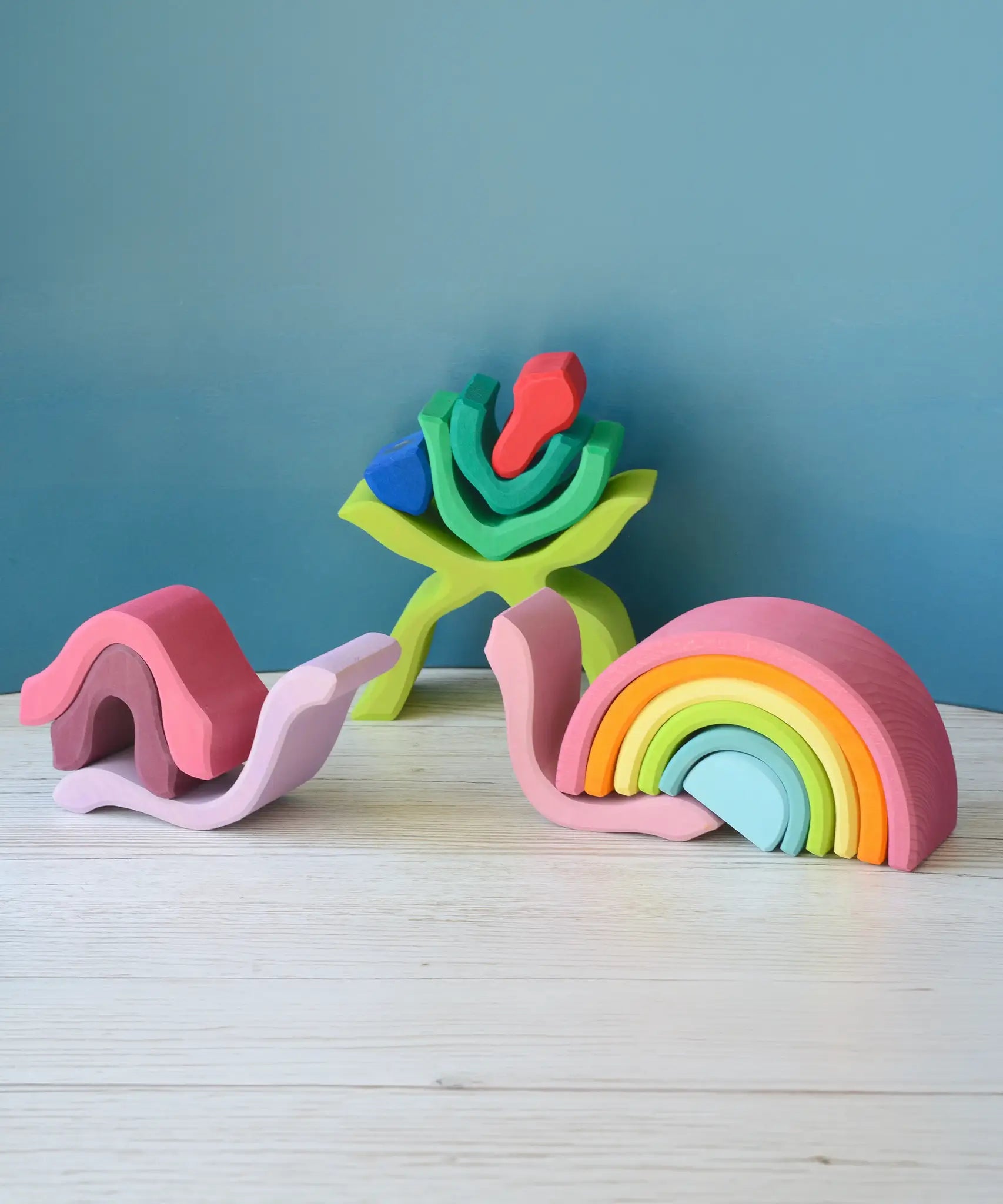 Pieces from the Grimms wooden little flower and medium pastel rainbow made into snails