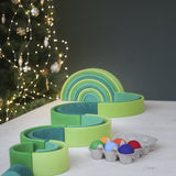 A winding ball run made from the Grimms meadow large green wooden rainbow set available at Babipur