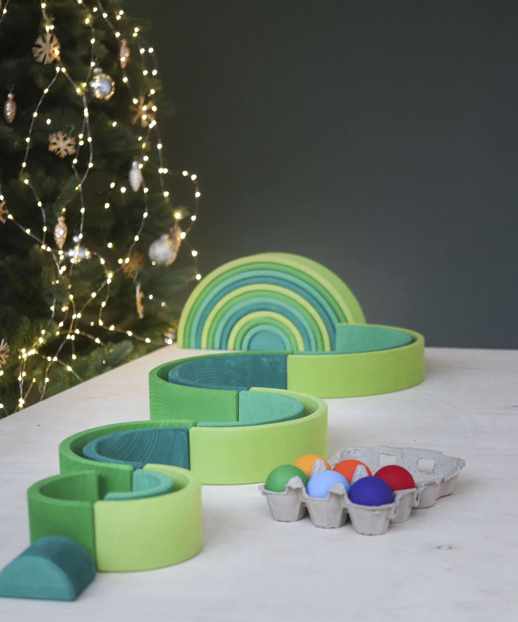 A winding ball run made from the Grimms meadow large green wooden rainbow set available at Babipur