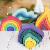 Grimm's mini earth set with a mini rainbow, fire and water waves in the bakground