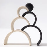 Grimm's mini monochrome wooden rainbow stacked up.
