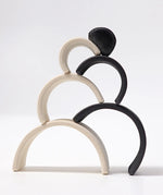 Grimm's mini monochrome wooden rainbow stacked up.