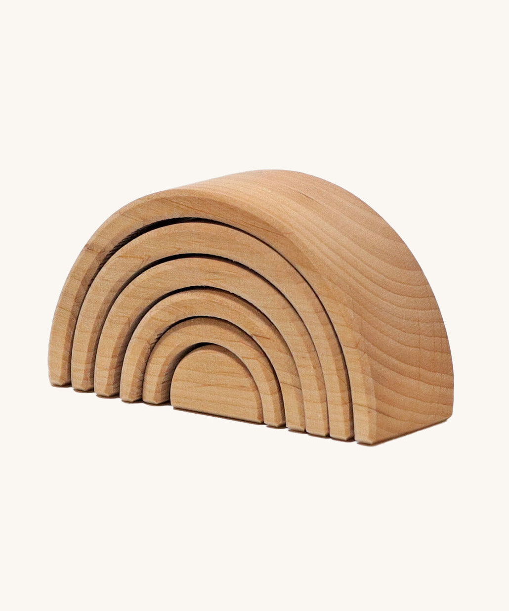 A mini wooden Grimms rainbow stacking toy available at Babipur. This unpainted stacking toy in handmade and has 6 pieces 