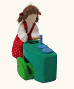 Grimm's blue and green mobile dolls home wooden toy play set sink with doll placed besides it.