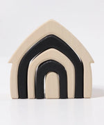 Front of Grimm's monochrome house. Showing 5 handcrafted wooden house shapes slot into each other