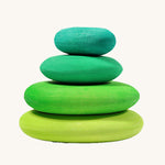 A set of 4 Grimm's wooden pebbles is a moss green colourway. 
