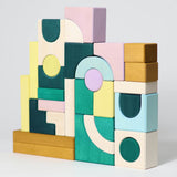 A simple build in a abstract style made from different hand carved Grimms movement building pieces