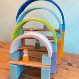 A archway structure made from Grimms wooden natural building boards and other wooden building blocks