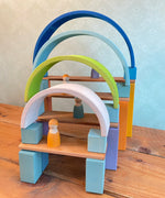 A archway structure made from Grimms wooden natural building boards and other wooden building blocks