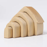 Back of Grimms handcrafted wooden natural house pieces showing each piece slotted into each other 