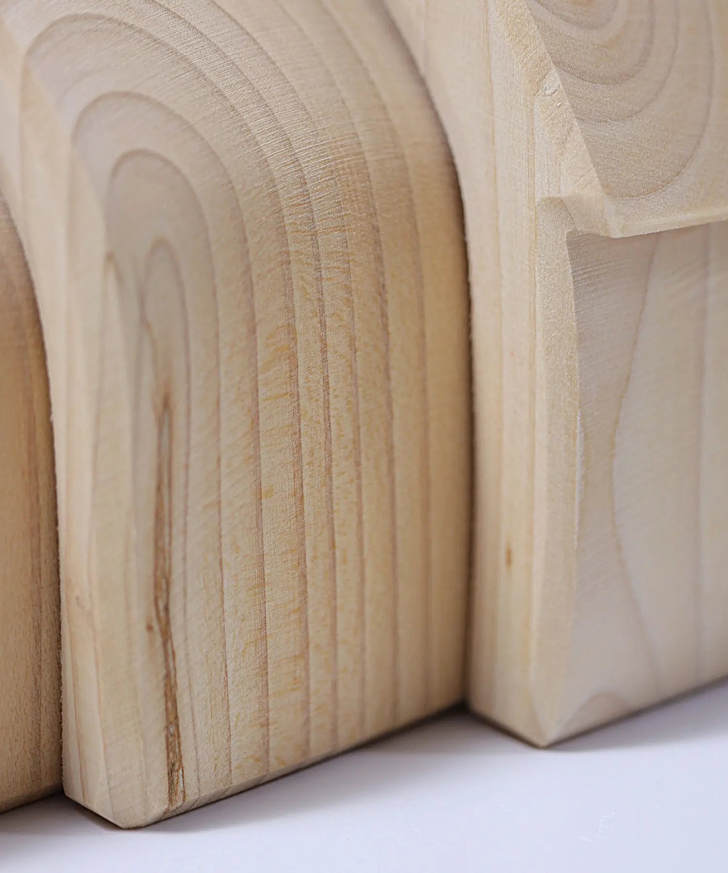 Grimms handcrafted wooden natural house pieces showing close up of grain detail on each piece