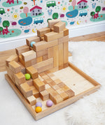 Grimm's Natural Large Stepped Pyramid used to create a ball run used with pastel balls. 