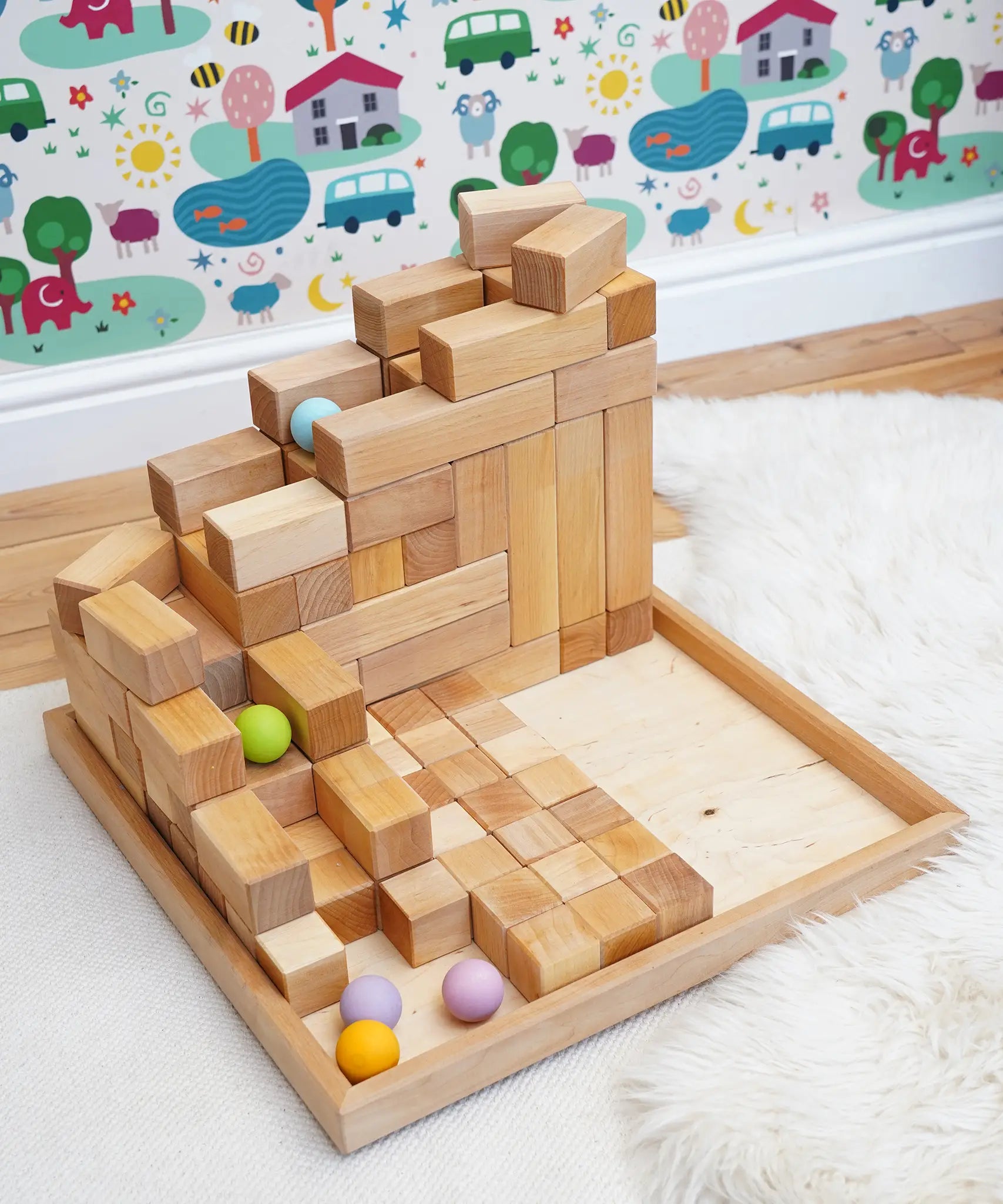 Grimm's Natural Large Stepped Pyramid used to create a ball run used with pastel balls. 